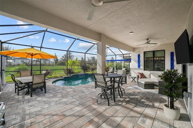 17702 Cresswind Ter, Bradenton, FL 34211 - view of patio with a ceiling fan, outdoor dining area, an outdoor pool, and a lanai