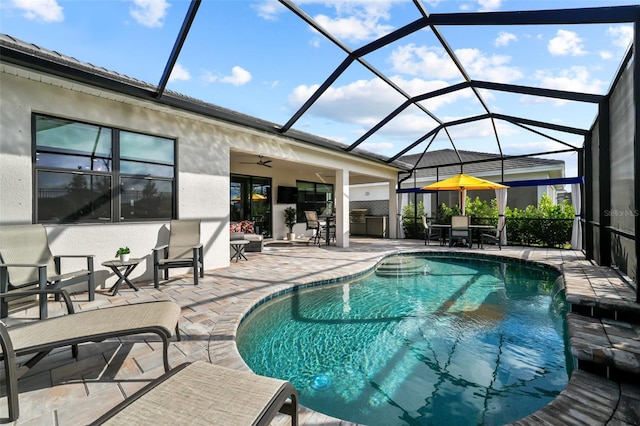 17702 Cresswind Ter, Bradenton, FL 34211 - swimming pool with a patio, ceiling fan, glass enclosure, and outdoor dining space