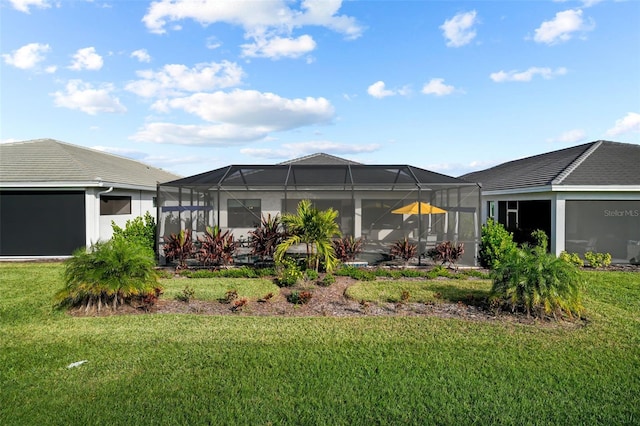 17702 Cresswind Ter, Bradenton, FL 34211 - rear view of house with a lawn and glass enclosure