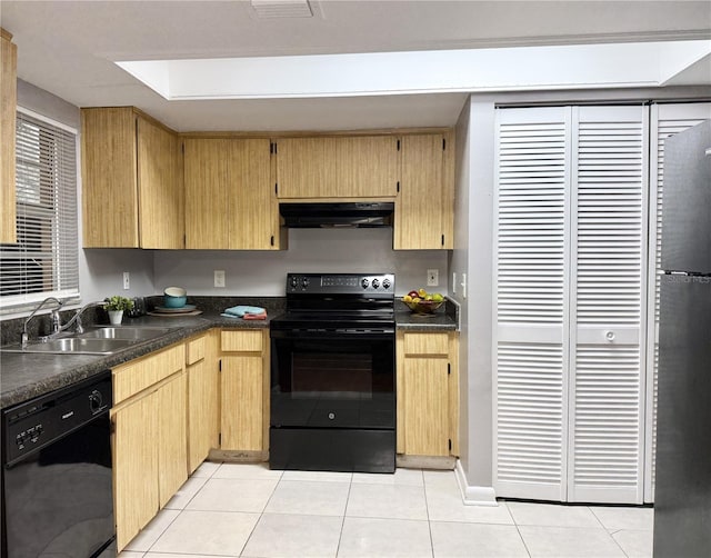 kitchen featuring black appliances, light tile patterned flooring, sink, and light brown cabinetry