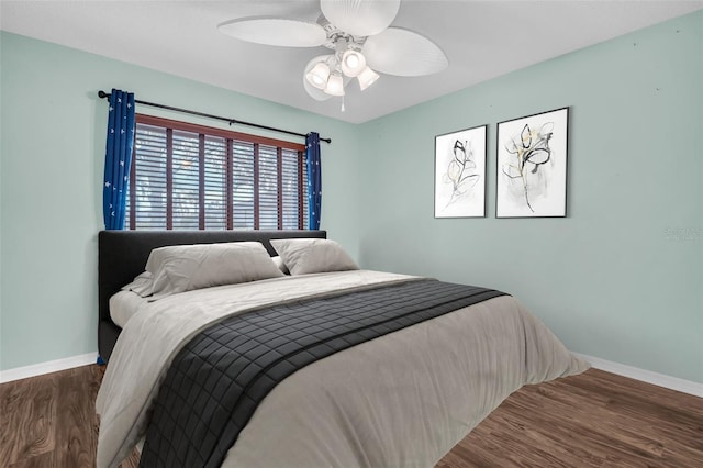 bedroom featuring ceiling fan and wood-type flooring