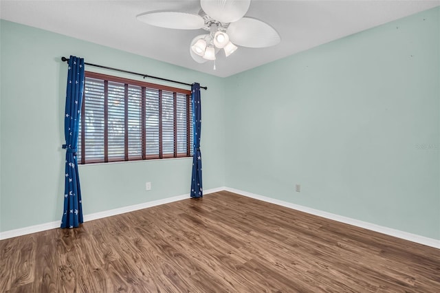 empty room featuring ceiling fan and wood-type flooring