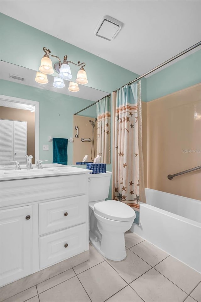 full bathroom with tile patterned floors, toilet, vanity, and shower / tub combo with curtain