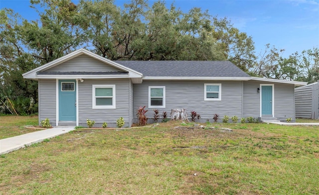 ranch-style house with a front lawn