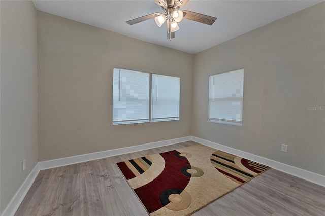 unfurnished room featuring ceiling fan and light hardwood / wood-style flooring