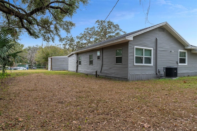 view of side of property with cooling unit