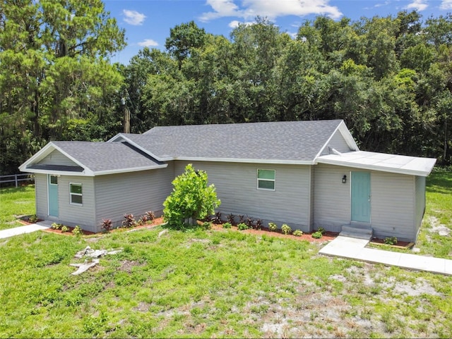 ranch-style home with a front yard