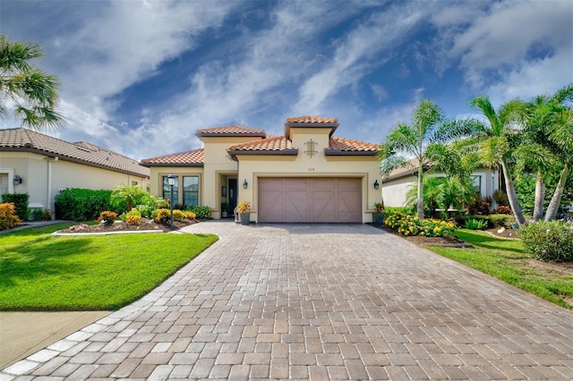 mediterranean / spanish house with a garage