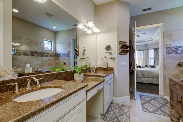 bathroom featuring tile patterned flooring, vanity, and ornamental molding