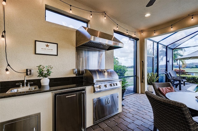 view of patio featuring an outdoor kitchen, a grill, a lanai, and sink