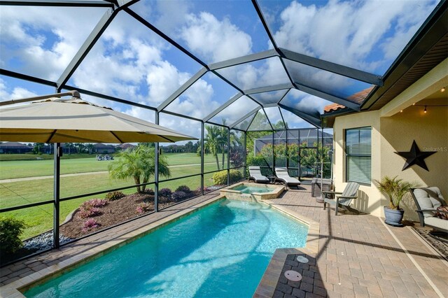 view of swimming pool with a lawn, a patio area, a lanai, and an in ground hot tub