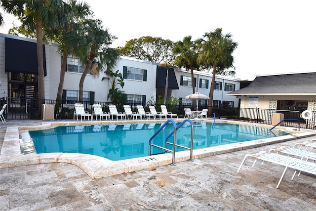 view of swimming pool featuring a patio area