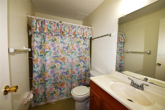 bathroom featuring vanity, curtained shower, and toilet