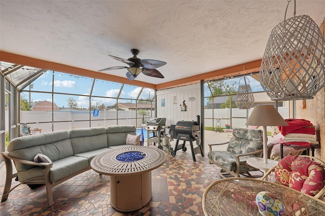 sunroom / solarium with ceiling fan and a wealth of natural light