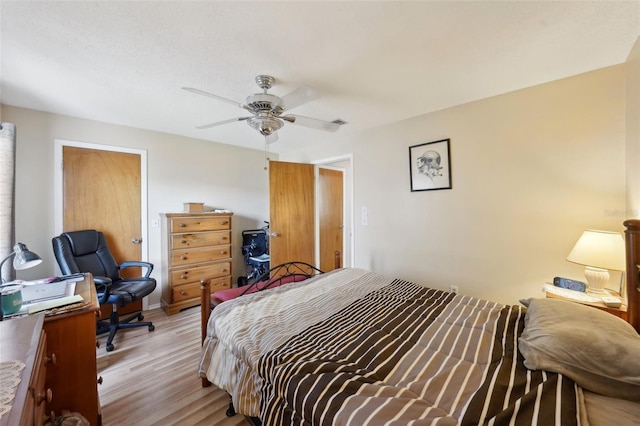 bedroom featuring light wood-type flooring and ceiling fan