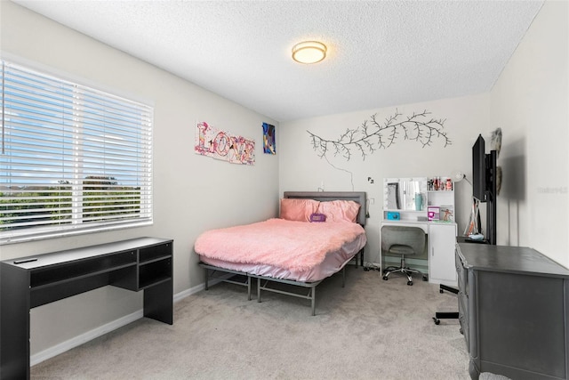 carpeted bedroom featuring a textured ceiling