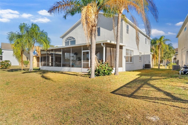 back of house featuring a lawn, central AC, and a sunroom