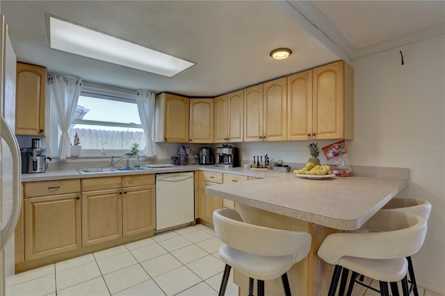 kitchen with sink, a kitchen breakfast bar, white dishwasher, light brown cabinetry, and light tile patterned flooring