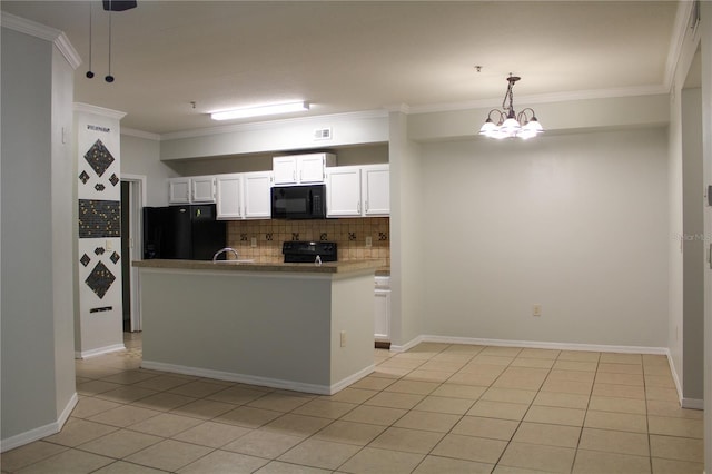 kitchen with light tile patterned floors, an inviting chandelier, kitchen peninsula, white cabinets, and black appliances