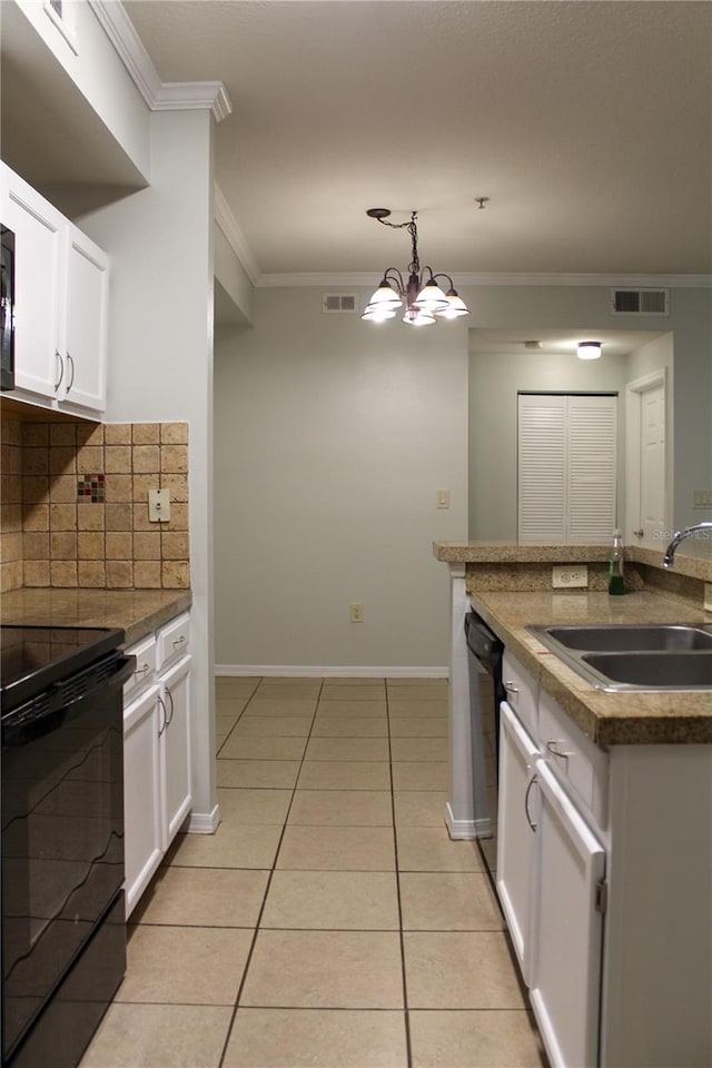 kitchen featuring white cabinets, sink, light tile patterned floors, a chandelier, and black electric range oven