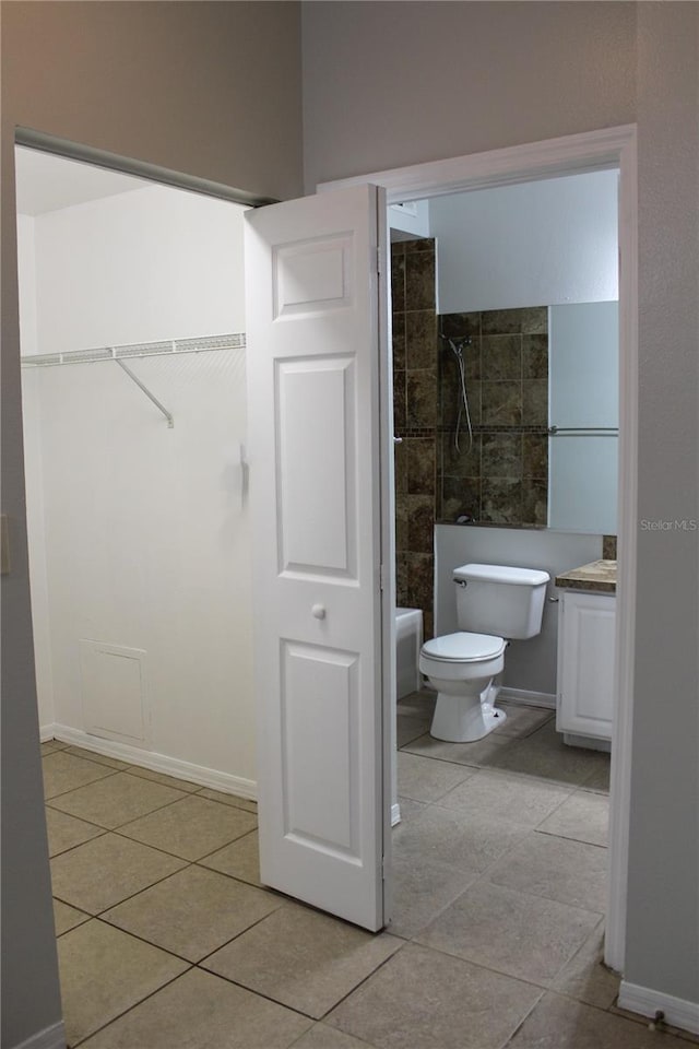 full bathroom with tile patterned flooring, vanity, bathtub / shower combination, and toilet