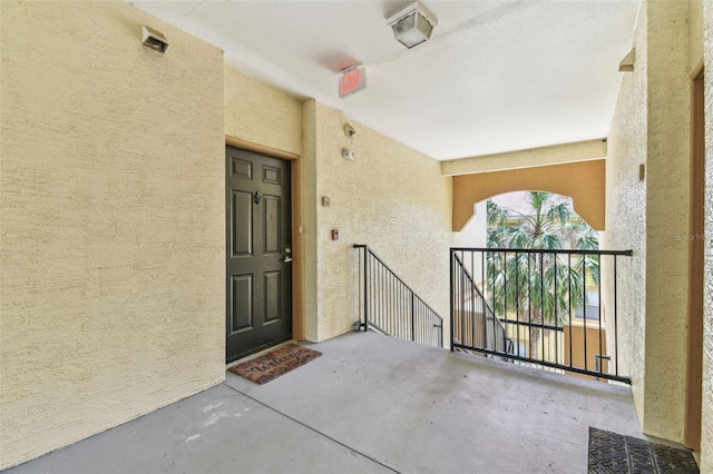 5606 Pinnacle Heights Cir Unit 304, Tampa, FL 33624 - view of exterior entry featuring stucco siding