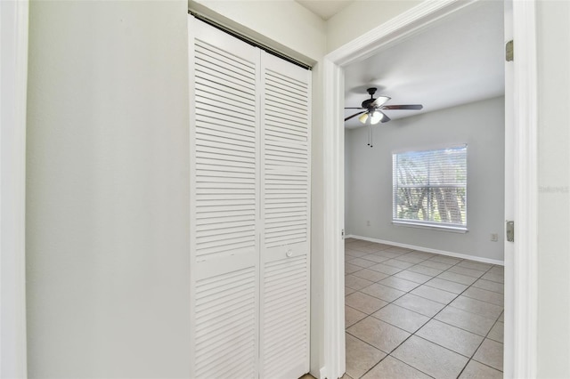 5606 Pinnacle Heights Cir Unit 304, Tampa, FL 33624 - hall with light tile patterned floors and baseboards