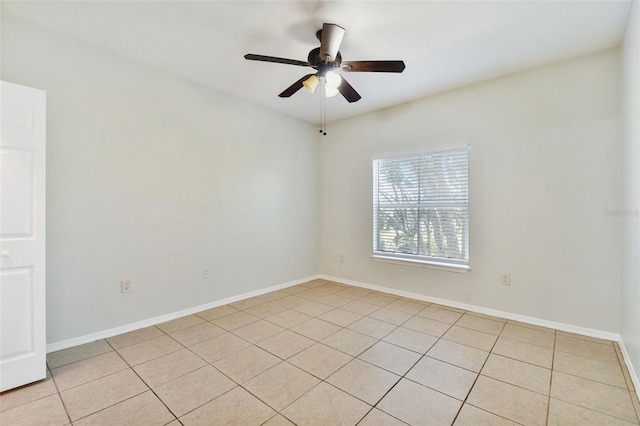 5606 Pinnacle Heights Cir Unit 304, Tampa, FL 33624 - spare room with a ceiling fan, light tile patterned flooring, and baseboards