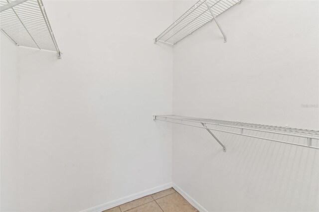 5606 Pinnacle Heights Cir Unit 304, Tampa, FL 33624 - spacious closet with light tile patterned floors