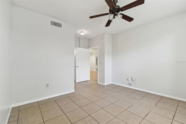 5606 Pinnacle Heights Cir Unit 304, Tampa, FL 33624 - empty room featuring light tile patterned floors, ceiling fan, and baseboards