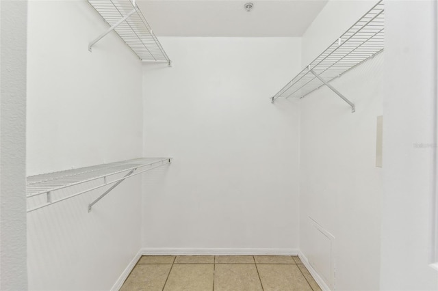 5606 Pinnacle Heights Cir Unit 304, Tampa, FL 33624 - spacious closet featuring light tile patterned floors