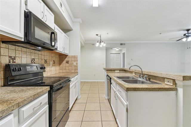 5606 Pinnacle Heights Cir Unit 304, Tampa, FL 33624 - kitchen featuring black appliances, a sink, ornamental molding, a center island with sink, and decorative backsplash