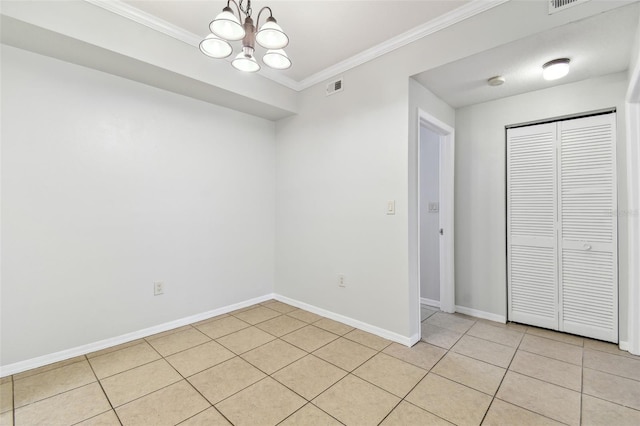 5606 Pinnacle Heights Cir Unit 304, Tampa, FL 33624 - unfurnished dining area with a chandelier, baseboards, ornamental molding, and light tile patterned floors