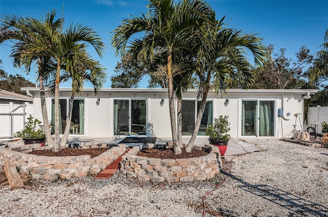 back of property featuring a patio