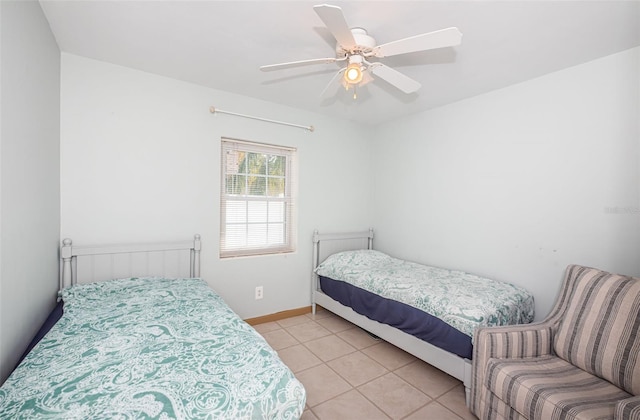 tiled bedroom with ceiling fan