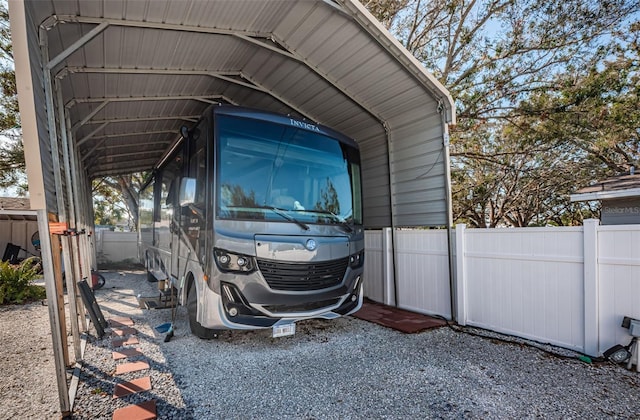 view of parking / parking lot with a carport