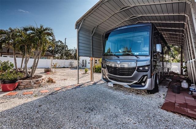 view of vehicle parking with a carport