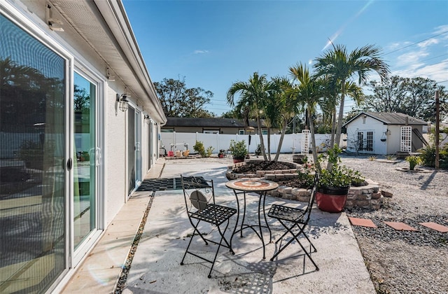 view of patio / terrace with an outbuilding