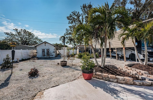 view of yard featuring french doors and an outbuilding