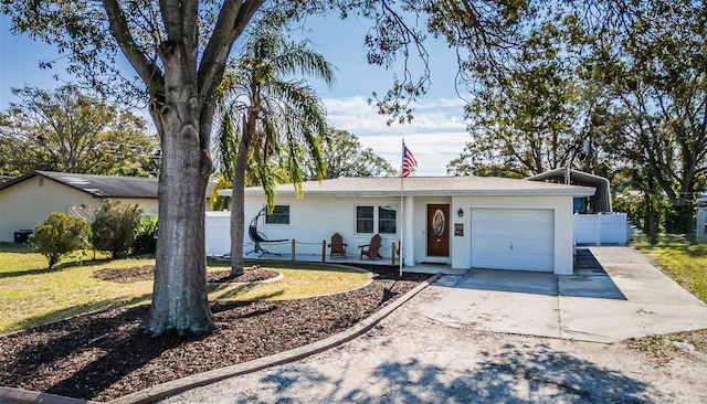 ranch-style home with a front yard and a garage