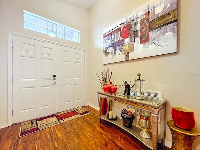 entrance foyer with dark hardwood / wood-style floors