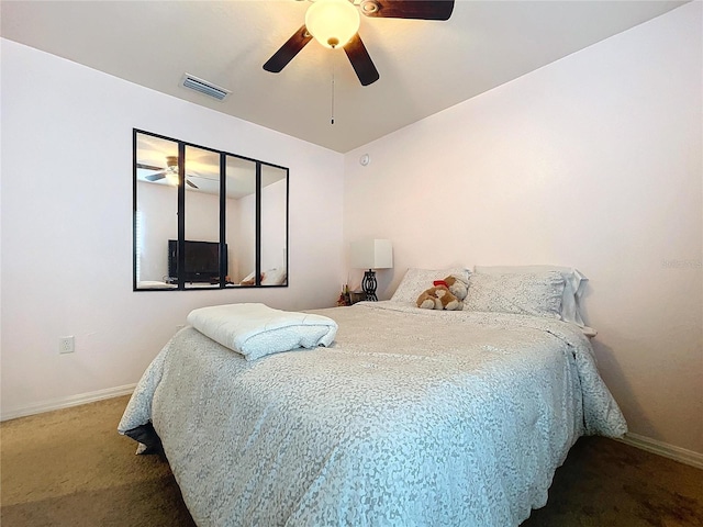 carpeted bedroom with ceiling fan