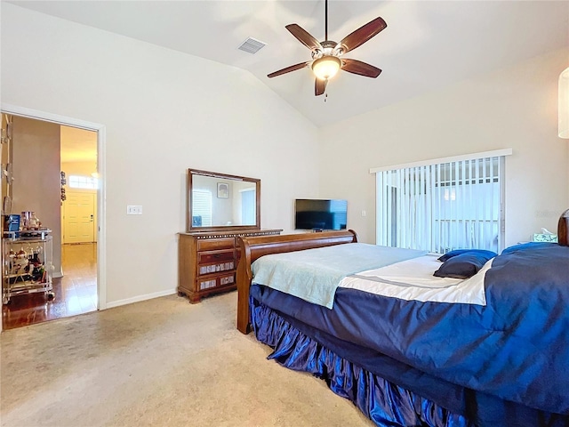 bedroom featuring light carpet, ceiling fan, and lofted ceiling