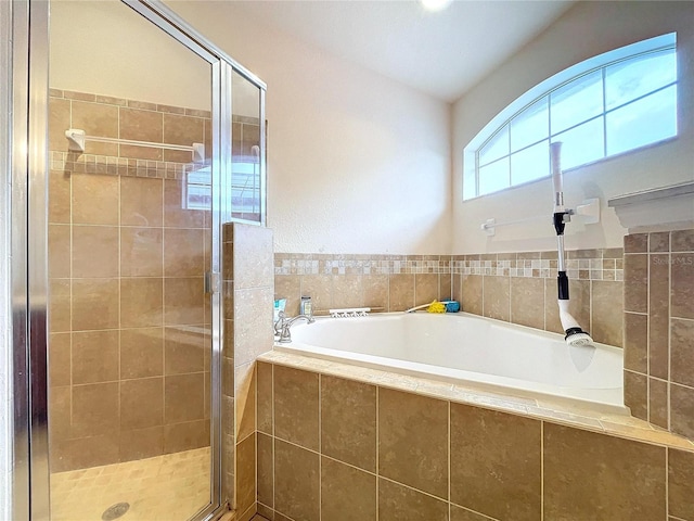 bathroom with separate shower and tub