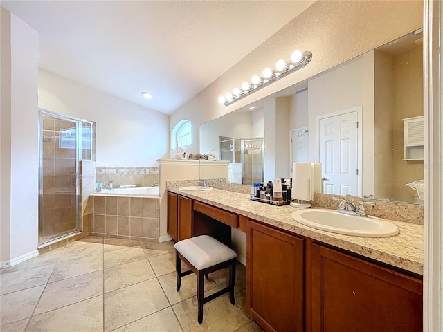 bathroom with tile patterned flooring, vanity, and plus walk in shower