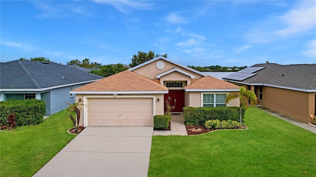 view of front of home with a garage and a front lawn