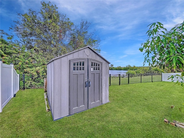 view of outbuilding featuring a yard