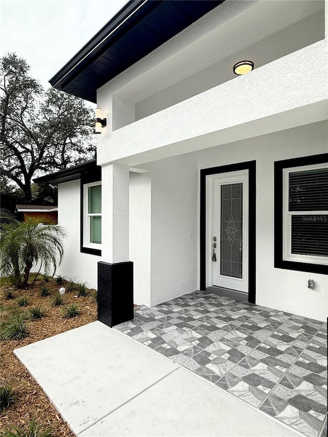 doorway to property featuring a patio