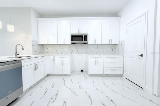 408 E Hanlon St, Tampa, FL 33604 - kitchen featuring tasteful backsplash, stainless steel microwave, marble finish floor, a sink, and dishwashing machine