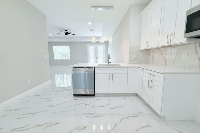 408 E Hanlon St, Tampa, FL 33604 - kitchen with marble finish floor, a sink, stainless steel appliances, and a peninsula